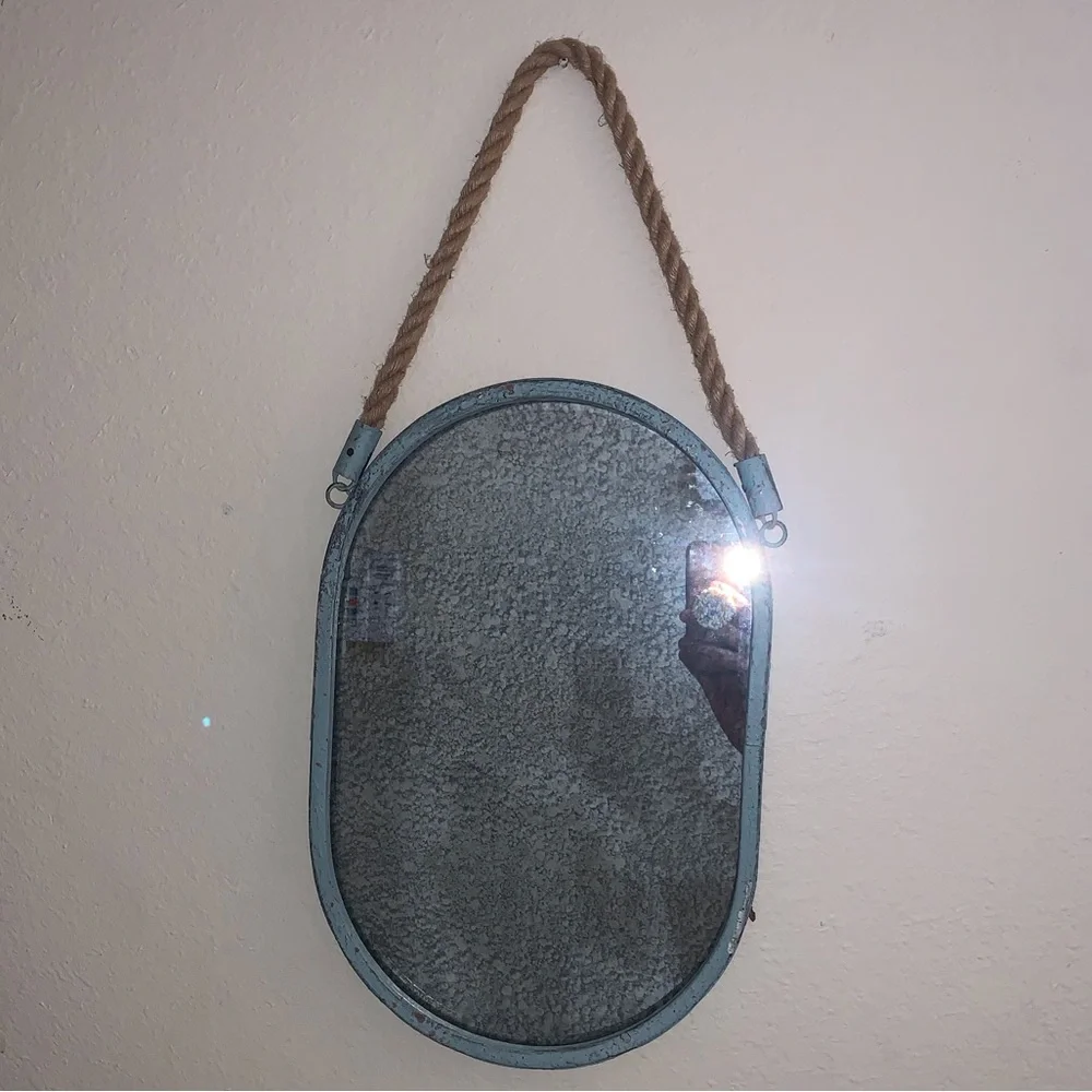 Oval Mirror with Blue metal surrounding and rope to hang